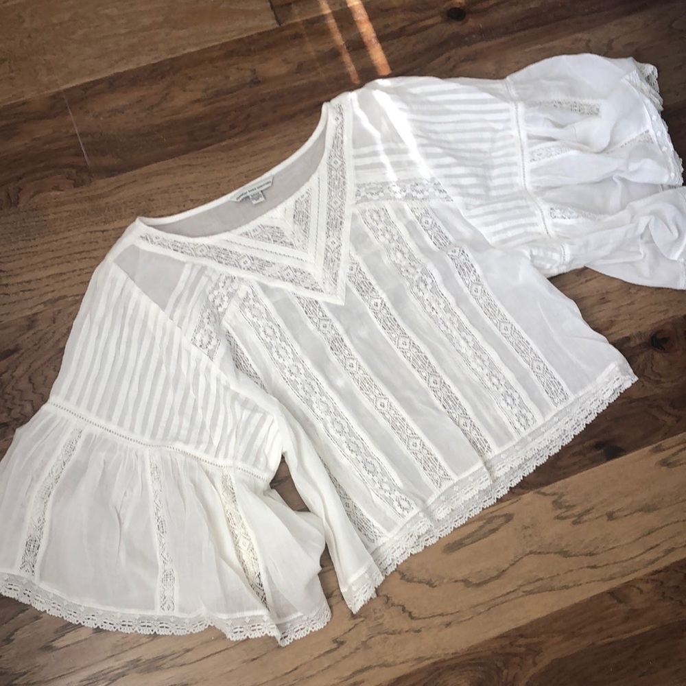 Sheer white top with crochet detail